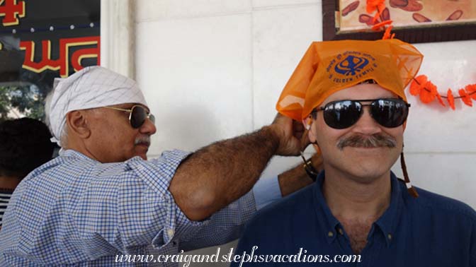 Mukul ties Craig's kerchief