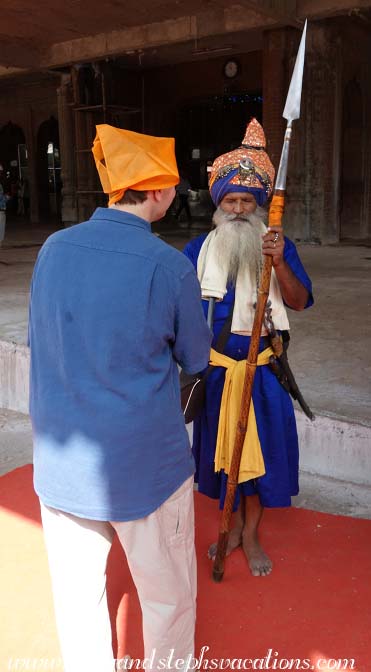 A uniformed Khalsa greets Craig