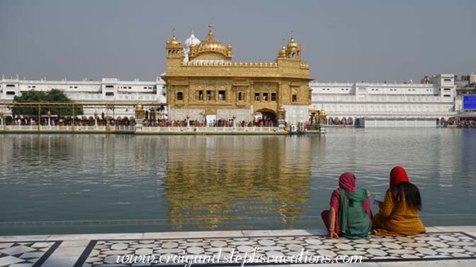 Women gaze at the Golden Temple