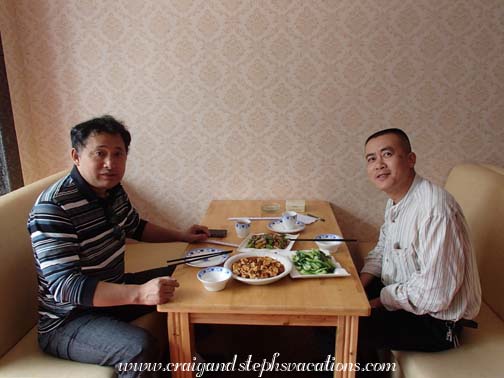 Mr. Zhou and Wang Jun at lunch