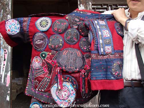 Woman's hand-embroidered festival jacket, made up of 800,000 silk triangles