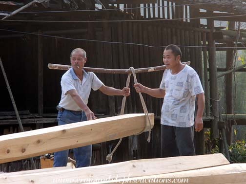 Carpenters transporting logs for the new drum tower Carpenters transporting logs for the new drum tower