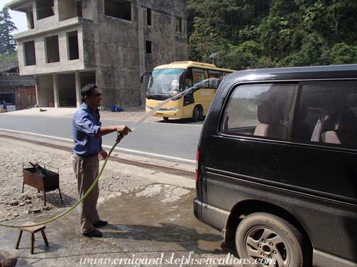 Mr. Zhou washes the van during lunch