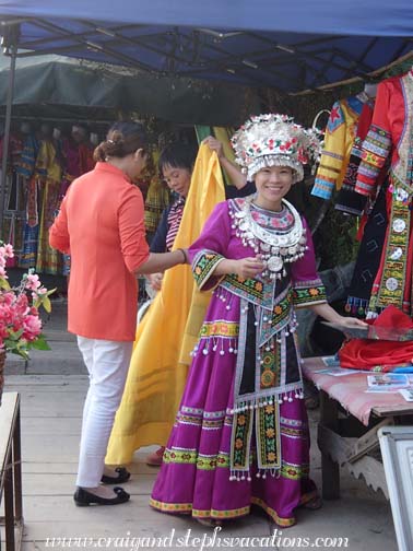 Our new friend gets dressed in traditional Miao clothing