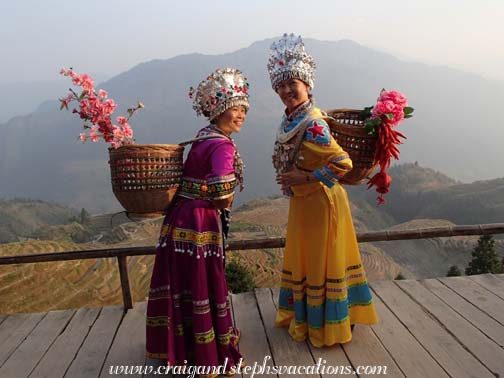 Our new friend gets photographed in traditional Miao clothing