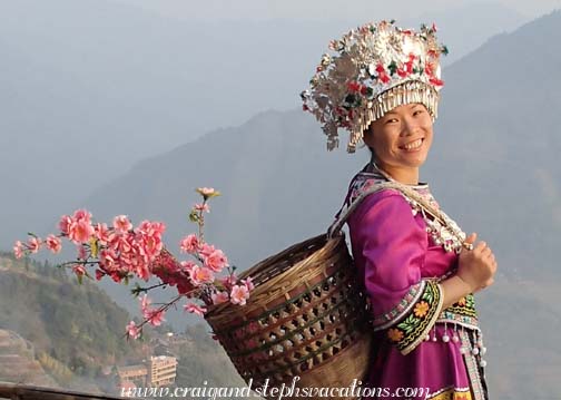 Our new friend gets photographed in traditional Miao clothing