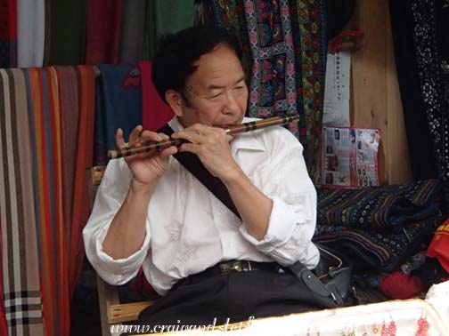 Shopkeeper's father plays the flute Shopkeeper's father plays the flute