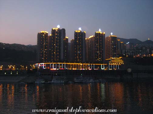 The boat passes a city The boat passes a city