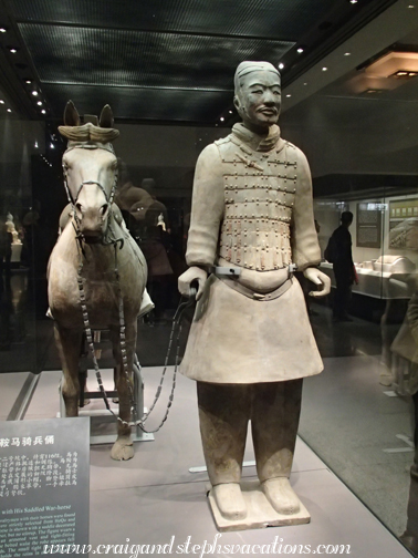 Terra cotta saddled war horse and infantryman in display case in Pit #2 Terra cotta saddled war horse and infantryman in display case in Pit #2