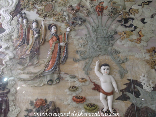 Jade carving depicting seven steps taken by Sakyamuni (Buddha) immediately after his birth Jade carving depicting seven steps taken by Sakyamuni (Buddha) immediately after his birth