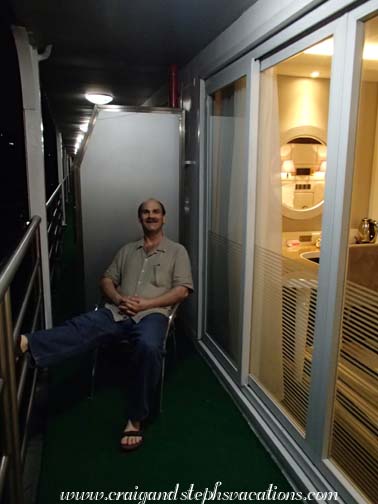 Craig sitting on our balcony