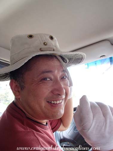 Mr. Zhou models Craig's smiling Tilley hat Mr. Zhou models Craig's smiling Tilley hat