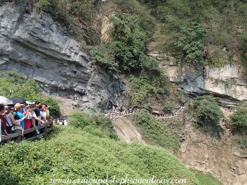 Queue to walk behind the water of Huangguoshu Falls Queue to walk behind the water of Huangguoshu Falls