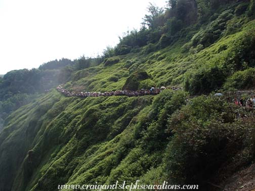 Queue to walk behind the water of Huangguoshu Falls Queue to walk behind the water of Huangguoshu Falls