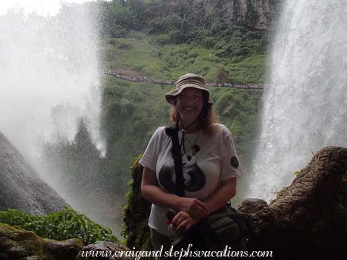 Steph behind Huangguoshu Falls (note the long queue for the waterfall in the background)