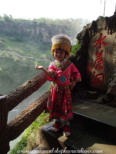 Girl being photographed in traditional Miao dress Girl being photographed in traditional Miao dress