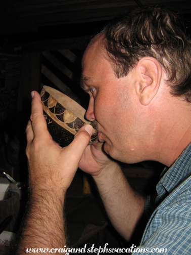 Craig drinks out of a coconut cup