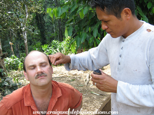 Edmundo painting Craig's face Edmundo painting Craig's face