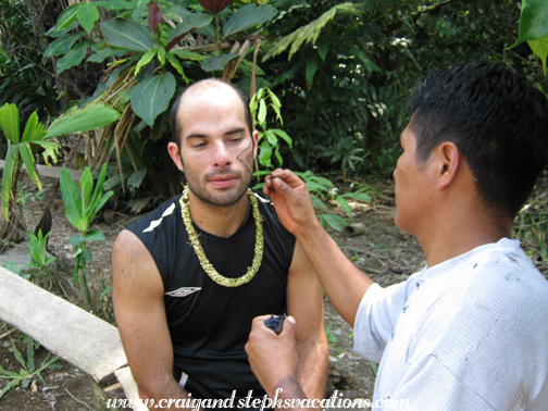Edmundo paints Felipe's face Edmundo paints Felipe's face