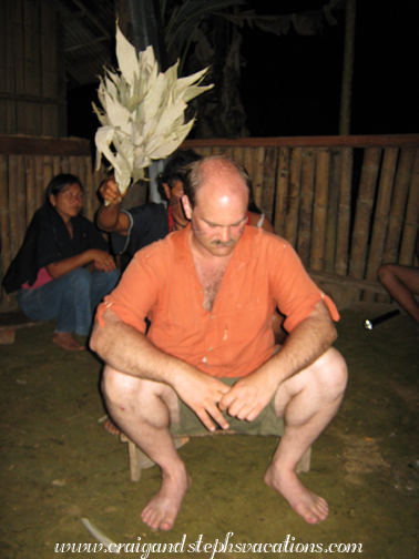 Carlos purifies Craig with a bundle of leaves Carlos purifies Craig with a bundle of leaves