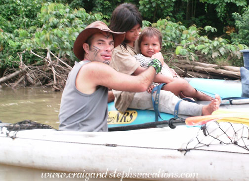 Felipe plays with a Huaorani baby Felipe plays with a Huaorani baby