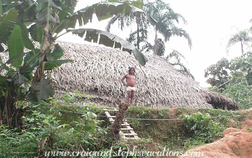 Huaorani man in front of his house Huaorani man in front of his house