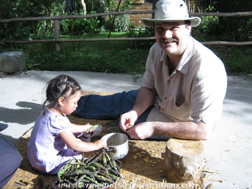 Sisa and Craig shucking beans