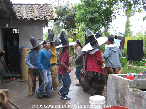 Inti Raymi dancers stop at the house for food and drink on their way to Cotacachi