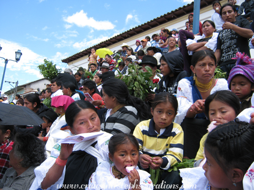 Community members wait for Mass to begin