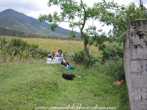 Aida and the kids next to the house where Rosa grew up