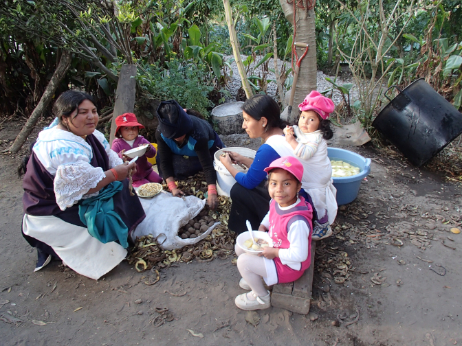 Friends and relatives gather to help with food preparation