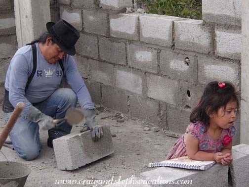 The family keeps Antonio company while laying concrete blocks for the 3rd floor walls The family keeps Antonio company while laying concrete blocks for the 3rd floor walls