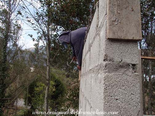 Marcelo prepares the wooden forms for the concrete beams Marcelo prepares the wooden forms for the concrete beams