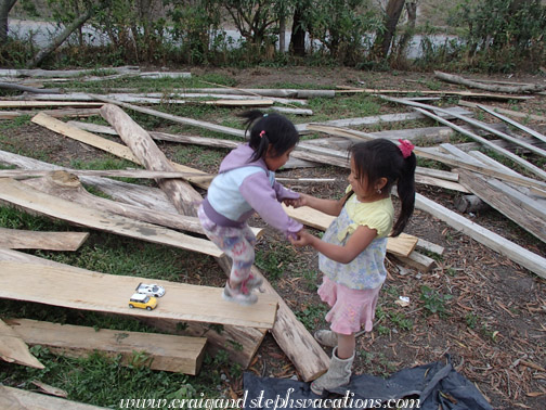 Tayanta and Sisa use the lumber as a trampoline Tayanta and Sisa use the lumber as a trampoline
