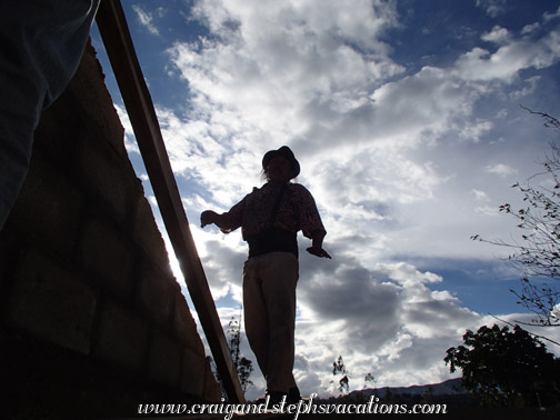 Antonio works on the roof beams Antonio works on the roof beams