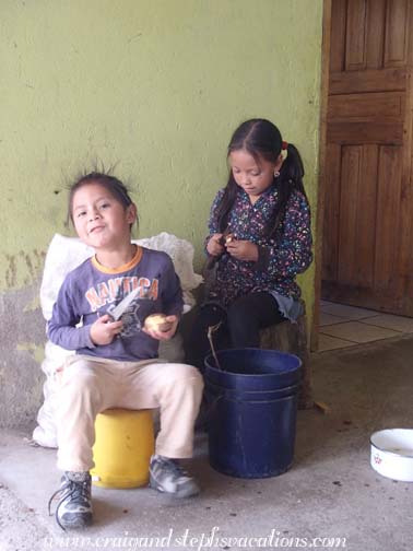 Yupanqui and Sisa peel potatoes Yupanqui and Sisa peel potatoes