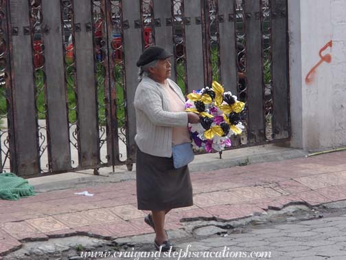 Woman selling wreaths to decorate the cemetery Woman selling wreaths to decorate the cemetery