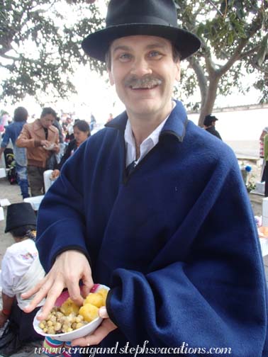 Craig eating the shared food at the cemetery