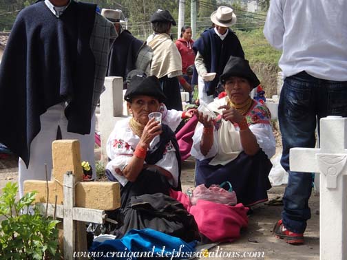 Women eating and drinking in the cemetery Women eating and drinking in the cemetery
