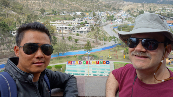Sonam and Craig in different hemispheres atop the Mitad del Mundo monument