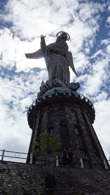 Sonam and Craig in front of the Virgin of Quito