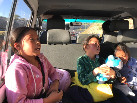 Sisa recounts her Galapagos adventure for the family on the ride back to Morochos