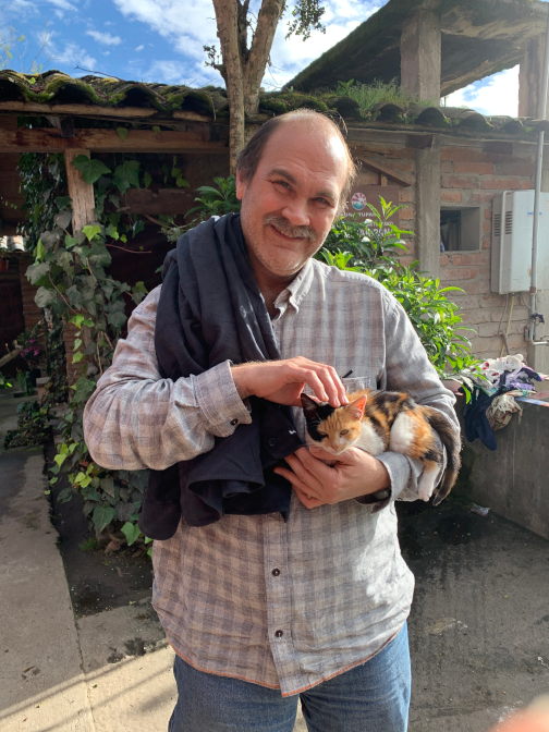 Craig holding a kitten in the sun