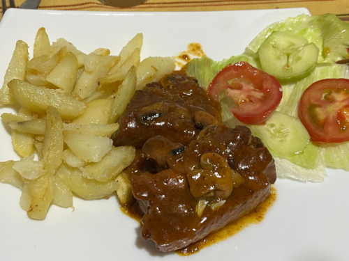 Ribs, fries, and salad