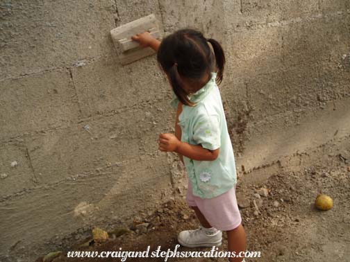 Aracely does some masonry work Aracely does some masonry work