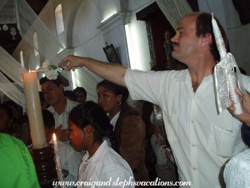 Craig lights the baptism candle Craig lights the baptism candle