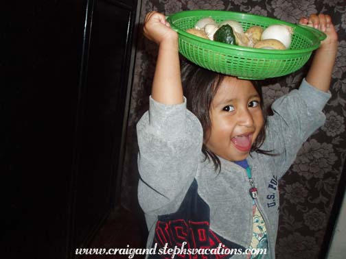 Aracely with a basket of vegetables Aracely with a basket of vegetables