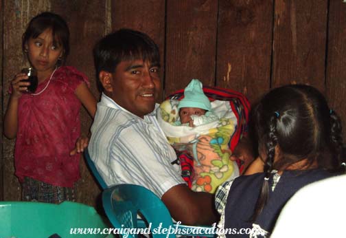 Humberto holding baby Angel Eduardo Humberto holding baby Angel Eduardo