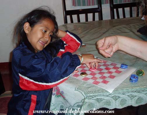 Playing checkers with Yoselin Playing checkers with Yoselin