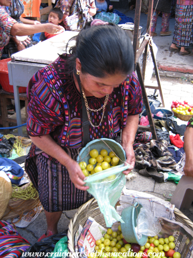 Woman selling us yellow plums Woman selling us yellow plums